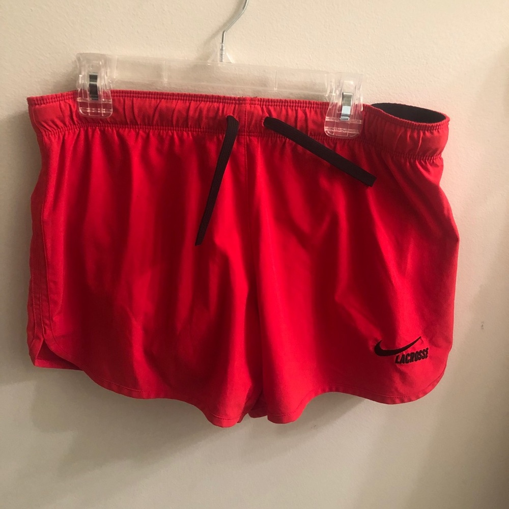 Red Nike shorts with spandex